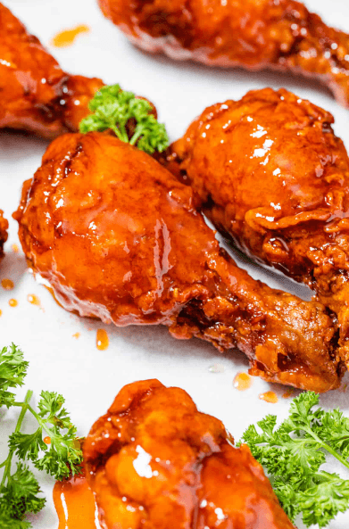 3 Chicken drums, tossed in spicy flavor served with a side of coleslaw